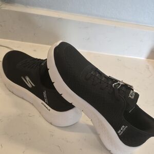 Skechers Women's Black Athletic Slip-On Sneakers with White Sole